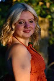 Mom taking senior pictures of son