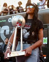 A'ja Wilson took a page out of MJ's book for her championship look 🏆🔥 Her  shirt was inspired by Michael Jordan's from 1993, the year he beat Phoenix  for his third ring