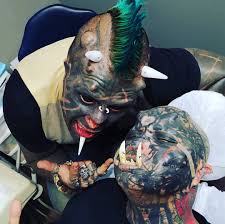Devotees say tattoos, piercings, and skin implants, like those seen here. Tattoo Artist Gets Tusks Over His Teeth To Look Like An Orc