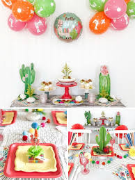 We found a cute chili table cloth for the dessert table and decorated beverage bottles with mexican hats and printed labels the ceiling was covered with helium balloons and fiesta bunting, we used colourful pink and blue glasses, maracas and mexican party decorations. Summer Fiesta Ideas Fun365
