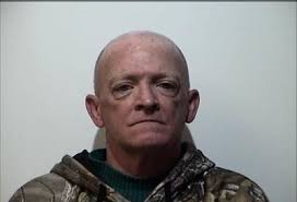 Man charged with threatening to blow up a donut shop