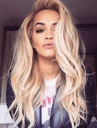 Photo of a very attractive blonde woman with beautiful brown eyes wearing a gray bra and sitting in front of head shot of a beautiful blond woman with brown eyes. Rita Ora Always Proving How Gorgeous Blonde Hair Pairs With Brown Eyes Love This Long Hair Styles Hair Styles Hair Beauty
