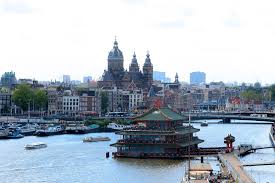 In The Middle Of This Waterway In Amsterdam Is The Chinese Restaurant Sea Palace For More Info About Restaur Amsterdam Travel Guide Amsterdam Travel Amsterdam