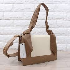 You can hold it like a handle or slide it sideways as per your convenience. Sag4303 Brown Charles Keith Knot Canvas Bag Sanfashions Canvas Bag Bags Charles Keith
