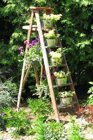 A wooden planter stand can be just the thing you need to make your beautiful plants stand out in an elegant and a simple way. 12 Creative And Rustic Garden Art Ladder Ideas