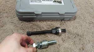 A bolt connects the threaded adapter to the shaft, and a thrust bearing slidably mounted upon the shaft is axially forced into engagement with the balancer by a shaft mounted nut. Diy Harmonic Balancer Installer Youtube