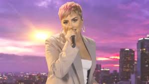 A pixie cut is a short women's haircut with short layers at the back and the sides and a longer section at the top. Demi Lovato Flaunts Pink Pixie Hair On Celebrating America Watch Hollywood Life