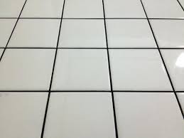 You'll notice both the tile color and the grout color, but they will complement rather than fight each other, and won't be as arresting together. White Tiles Grey Grout Photo K I On X Black Tile Bathroom White Subway Dark White Tiles Gray Grout White Tiles Black Grout White Tile Floor White Tiles