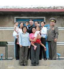 Armed with an accordion, guitar and a set of drums, the uniformed women sing and dance for the despot as he sits behind a desk. Photo Of A North Korean Family Being Delighted To Meet Their Awesome Leader Imgur Kim Jong Un Memes North Korea North Korea Facts