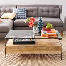 If you have a material of choice, look through a wide range of tables in different materials like marble, glass, wood, and metal. Glass Topped Industrial Storage Coffee Table