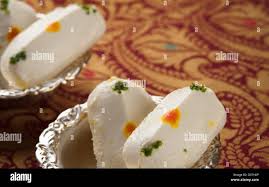 Close-up of cham cham a traditional Indian sweet made from chhena (cottage  cheese) and khoya (solid milk Stock Photo - Alamy