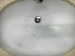 tired, cracked, stained bathroom sink