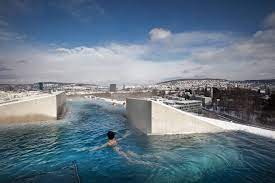 thermalbad is fed by zurich s aqui spring the bath s heated rooftop pool offers panoramic views zurich pool thermal bath