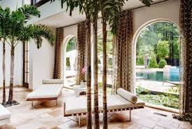 What You Need To Know About The Different Types Of Palm Tree Decor Home Design Interiors Tropical Living Room Tropical Living Indoor Palm Trees