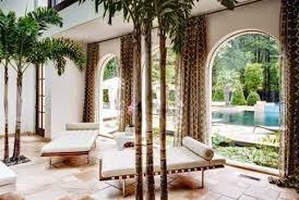 One will almost have the feel of a tropical drink in their hand as they admire the multiple. What You Need To Know About The Different Types Of Palm Tree Decor Home Design Interiors Tropical Living Room Tropical Living Indoor Palms