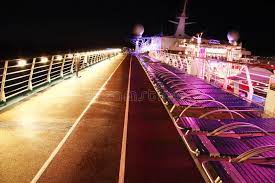 cruise ship deck at night colorful sunbeds and running track on the deck of a c affiliate deck night cruise ship colorful cruise ship cruise deck
