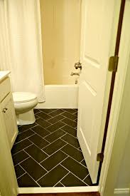 For the floor, installers often center a tile in the doorway. Small Bathroom Makeover Floor Tile