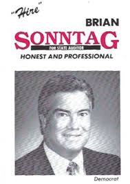 Our newest profile tells the story of Brian Sonntag. He grew up in Tacoma,  loving baseball and music, and fascinated by JFK and his assassination.  Following his Pierce County Auditor father Jack