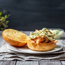 Nothing says eat me more than this spicy chicken sandwich recipe infused with hot buffalo flavor. Shredded Buffalo Chicken Sandwich With Avocado Ranch Sauce Hearth And Vine
