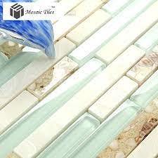 With floor to ceiling natural stone and glass tile in a custom blend of sugar cane, gold, and rain cloud. Aqua Backsplash Tile Sea Green Glass Conch Beach Style Tile White Stone Kitchen Bathroom Wall Art Mgt084 Aqua Pearl Tile Beach House Decor Beach Cottage Style
