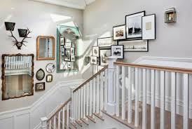 This home boasts a white walls and flooring along with glass doors and windows. Stairway Walls Decorating Ideas