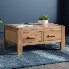 It features curves on all 4 sides which carry through both the. Molton Oak Coffee Table With 4 Drawers Oak Solution