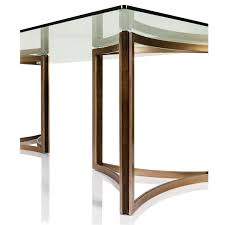 The Geometric Shape Of The Matte Gold Base With Insets Of Dark Fumed Oak Sets A Modern Tone Fo Glass Dining Table Glass Top Dining Table Furniture Dining Table
