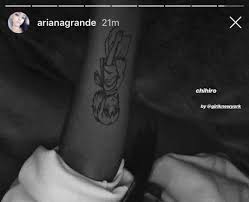 Seemingly in reference to her newest jam rain on me, ariana added a tiny umbrella just below the olive brand on her thumb. Ariana Grande Tattoos All 40 Of Ariana S Tattoos And Their Meanings Popbuzz