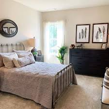 Add a touch of romance to a farmhouse bedroom with splashes of pink and purple. The Top 76 Farmhouse Bedroom Ideas Interior Home And Design