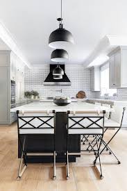 Black Kitchen Island With Black Industrial Pendant Lights Transitional Kitchen