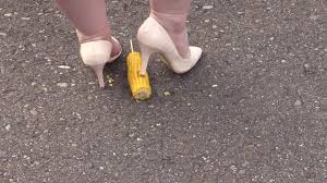 Crush-fetish. Thick legs in heels crushed the corn mercilessly.