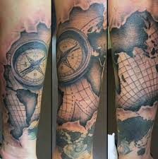 A cute compass tattoo with cursive writing that's perfect for a lady. 50 World Map Tattoo Designs For Men Adventure The Globe