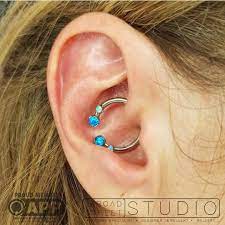 Here Is A Beautifully Adorned Daith Piercing Using All Anatometalinc Anatometaluk Components With Synthetic Blue Prong Daith Piercing Ear Piercings Piercing
