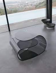 Investing in a designer coffee table will give your stylish living space a grand centrepiece. Coffee Table In Curved Glass High Quality Workmanship Office Idfdesign