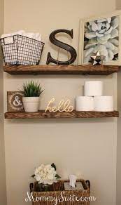If a stock vanity is too large for your small bathroom, rework a narrow wood table to hold a sink and storage. Diy Faux Floating Shelves Mommy Suite Diy Bathroom Decor Decor Cheap Home Decor