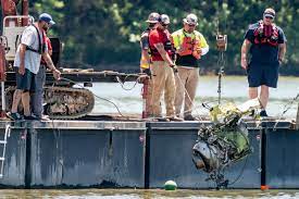 Emergency personnel remove debris sunday from a plane crash in percy priest lake near smyrna, tenn. Ht2dkmmmqk8nfm