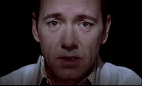 Crimson american beauty roses arranged stiffly in bowls throughout the house, in nearly every scene; Fifteen Years Later American Beauty Is Just A Bad Pretty Movie Decider