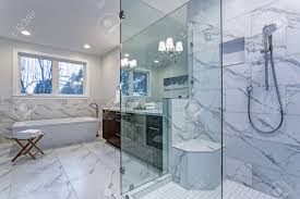 Quality manufacturing & installation of cultured marble, cultured granite, & cultured onyx in southern, oregon. Incredible Master Bathroom With Carrara Marble Tile Surround Stock Photo Picture And Royalty Free Image Image 96674997