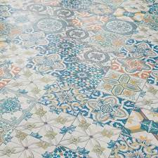 The monochromatic, moroccan floor tile she installed took the newly renovated space to a new chic level. Liberty Floors Aurora 8mm Ornate Moroccan Tile Laminate Flooring 47547 Leader Floors