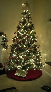 Criss Cross Ribbon Instead Of Garland Ribbon On Christmas Tree Holiday Decor Christmas Holiday Nails Winter