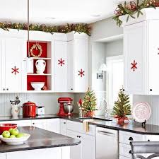 Christmas Kitchen Decorations Love The Garland Up Top With The Red Christmas Kitchen Decor Christmas Decorations Apartment Christmas Kitchen