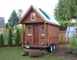 How Much Do Tiny Houses Cost Dee Williams Tiny House With A House On Wheels Tiny Home Cost Building A House Building Design