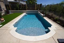 The Varying Shades Of Quartzscapes French Gray Transition From A Soft Gray To A Vibrant Blue Depending On The D Pool Finishes Pool Colors Backyard Pool Designs