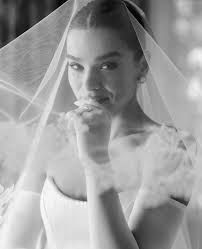 Hailee Steinfeld's wedding dress was custom Tamara Ralph. Her welcome and  after party dresses were Tamara Ralph autumn/winter 2024 and spring/summer  2025. Josh Allen wore custom Tom Ford tuxedo for the ceremony (