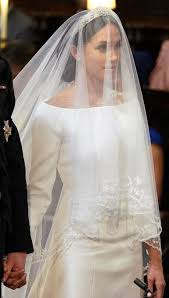 Prince harry and meghan markle sit during their wedding ceremony at st. Meghan Markle S Reception Dress Is Totally Fire Meghan Markle Wedding Dress Sparkle Wedding Dress Famous Wedding Dresses