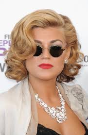 A cropped cut, side swept bangs, or pulled back hair can be a great choice for naturally curly hair. Melody Gardot Big Curls Sexy Blonde Curly Bob Hairstyle Hairstyles Weekly