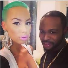 Sure her hairstyle choice doesn't matter when she has a brick. American Amber Rose Shows Off Green Hairstyle Ladies Would You Rock This Gistmania
