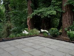 Square pavers arranged geometrically in the backyard of this home create a distinctive walkway through and around the yard. How To Make A Modern Patio With Pavers Pea Gravel The Savvy Heart Interior Design Decor And Diy