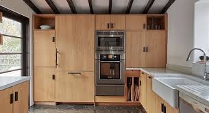 You can see how the dark cabinets with the furr down (or soffit) above, make for a long, horizontal boring wall with the feel of a low ceiling. Dealing With Wasted Space On Top Of Kitchen Cabinets