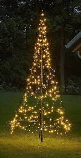 Will You Fake It This Year Artificial Christmas Trees Have Never Been So Chic Outdoor Christmas Diy Outdoor Christmas Lights Outdoor Christmas